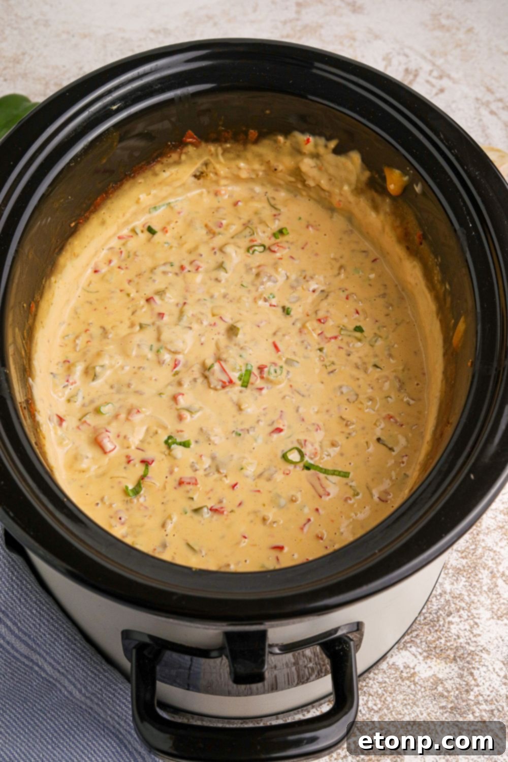 Crock Pot Philly Cheesesteak Dip in a crockpot sitting on a table 
