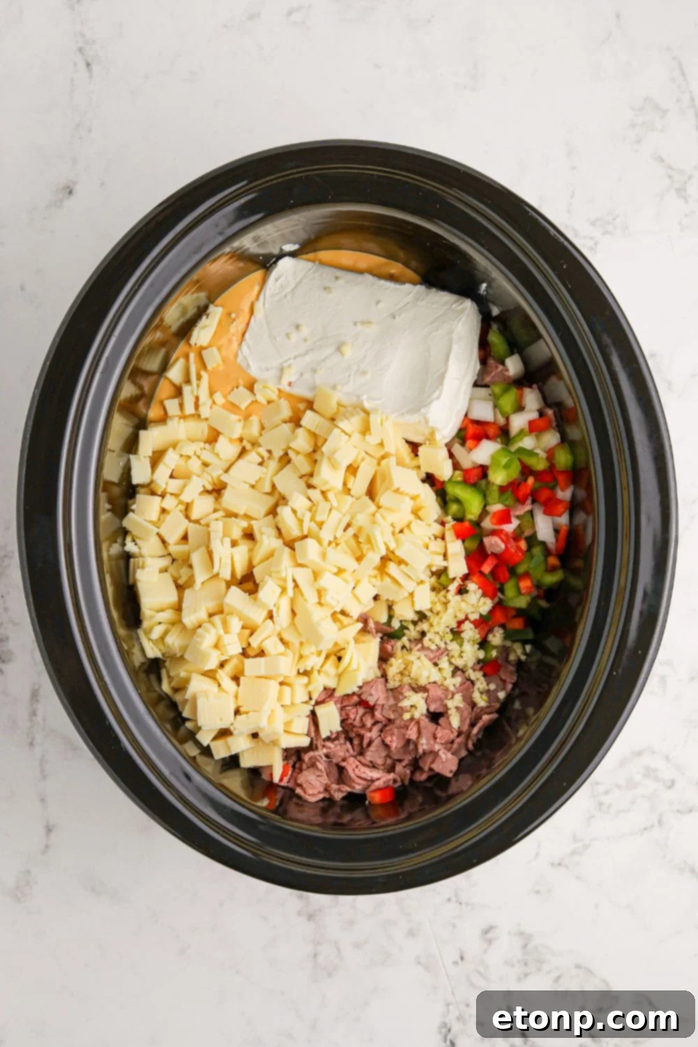 Crock Pot Philly Cheesesteak Dip in an oval crockpot 