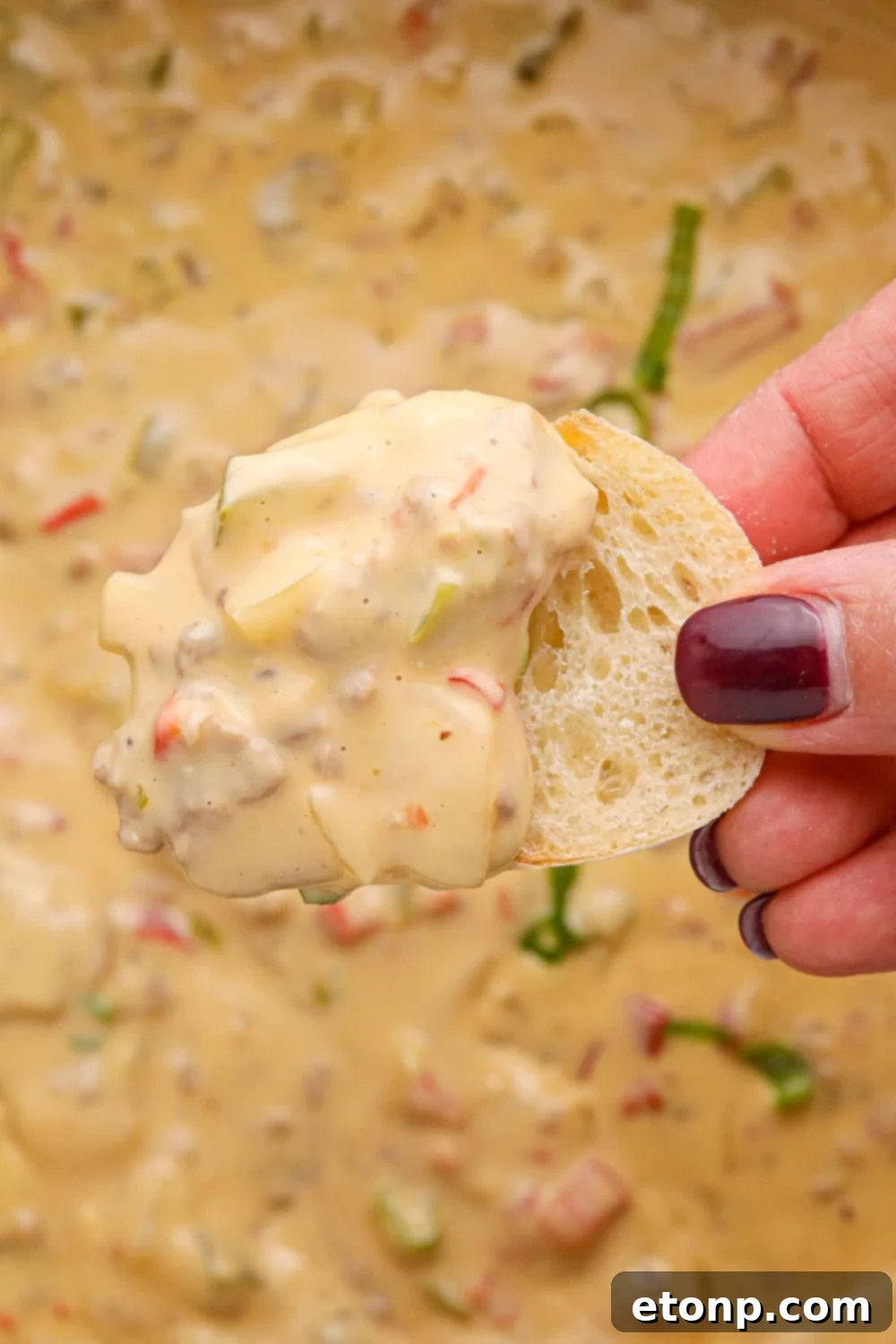 Crock Pot Philly Cheesesteak Dip on a piece of sliced bread