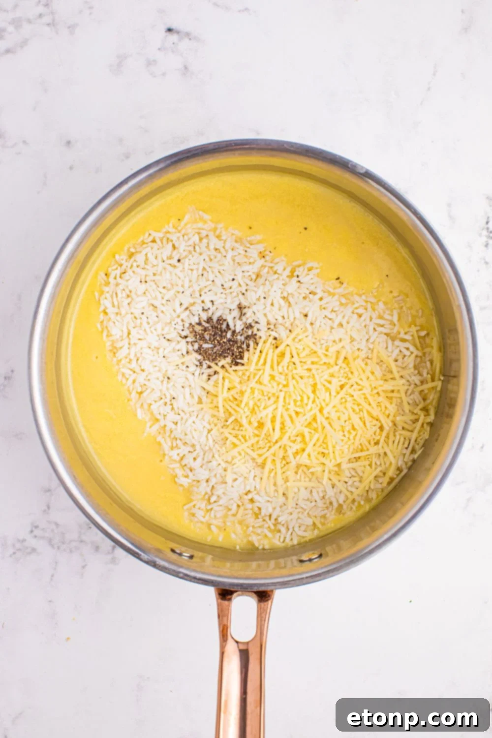 Souper Rice ingredients all poured into a saucepan sitting on the table