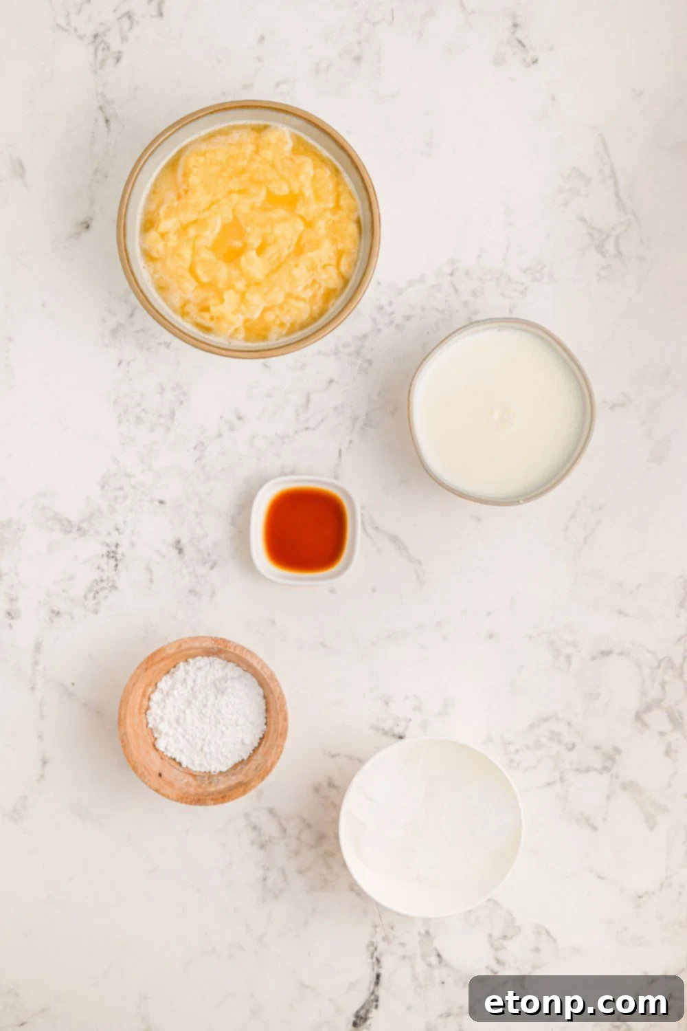 Copycat Orange Julius ingredients on table - orange juice concentrate, milk, powdered sugar, vanilla extract 