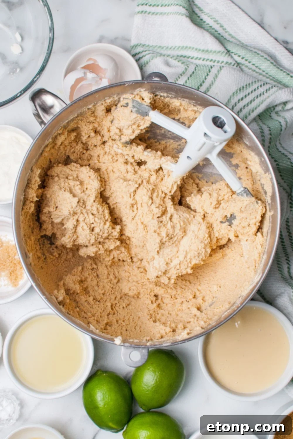 Crumbl Key Lime Pie Cookie dough in a mxing bowl on table