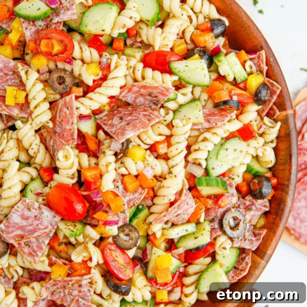 Vibrant Summer Pasta Salad 2 Summer Pasta Salad in a wooden bowl on table