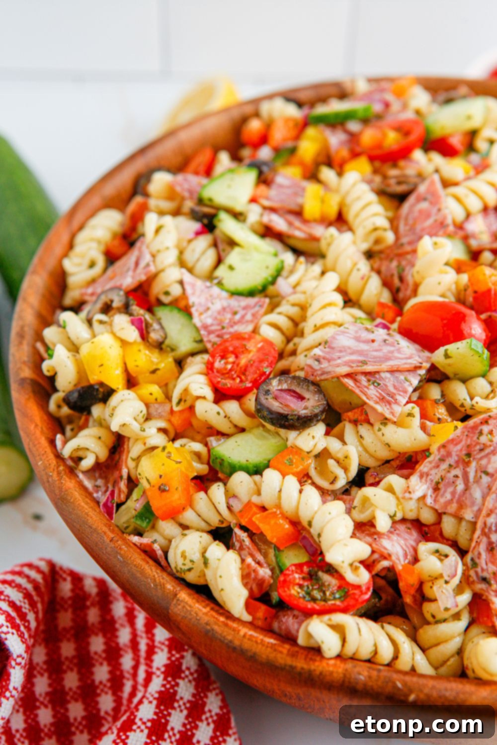 Vibrant Summer Pasta Salad 18 Summer Pasta Salad in a bowl with a side view so you see pasta and crisp veggies on top