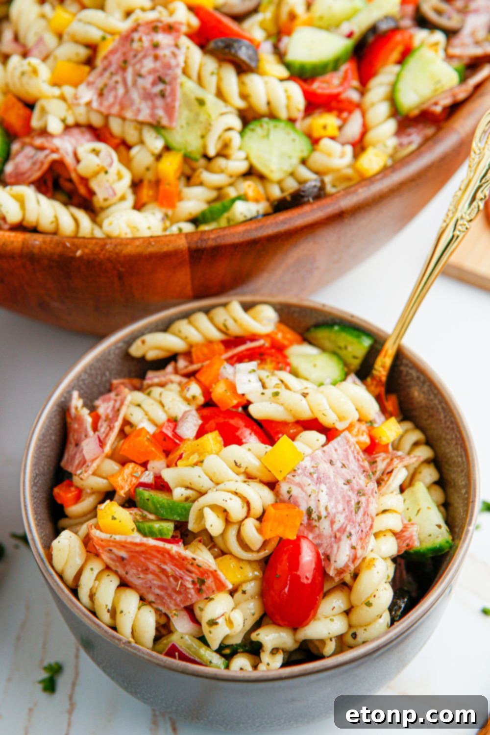 Vibrant Summer Pasta Salad 3 Summer Pasta Salad in a small bowl with a spoon in it