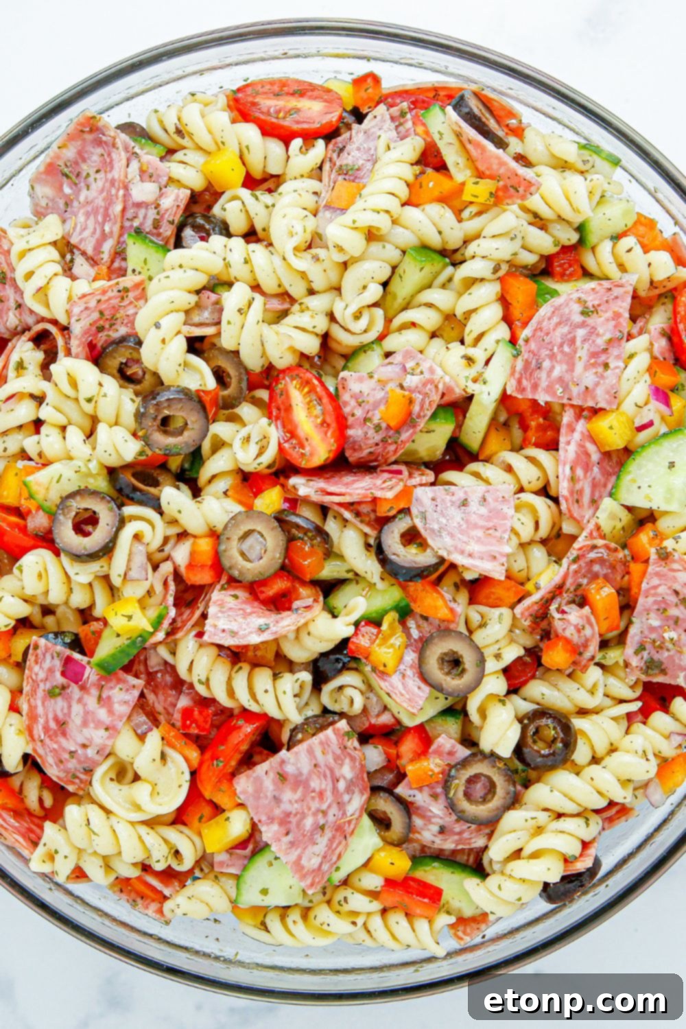 Vibrant Summer Pasta Salad 8 Summer Pasta Salad in a glass bowl mixed up