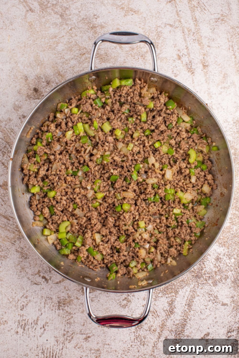 Cajun Dirty Rice 9 Dirty Rice - ground meat and vegetables in pan on table