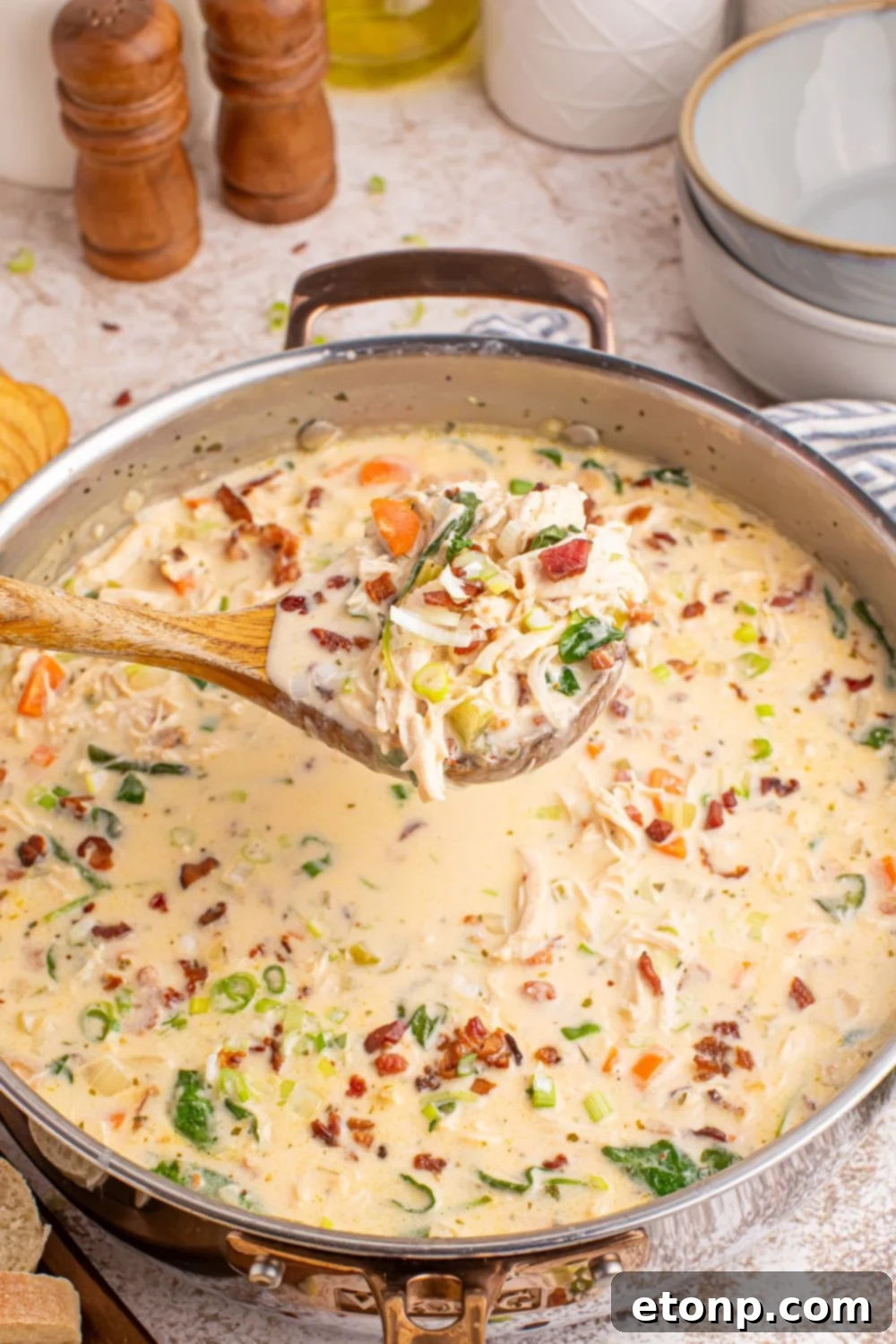 Creamy Ranch Chicken Soup 4 Crack Chicken Soup in a pan with a ladle of soup above the pan
