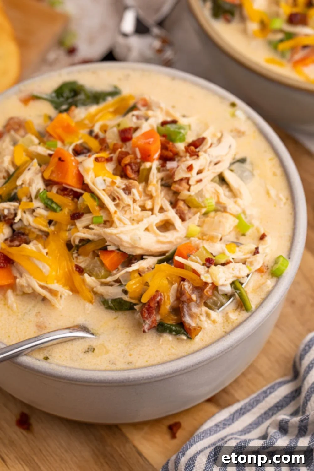 Creamy Ranch Chicken Soup 5 Crack Chicken Soup in a bowl with a spoon in it