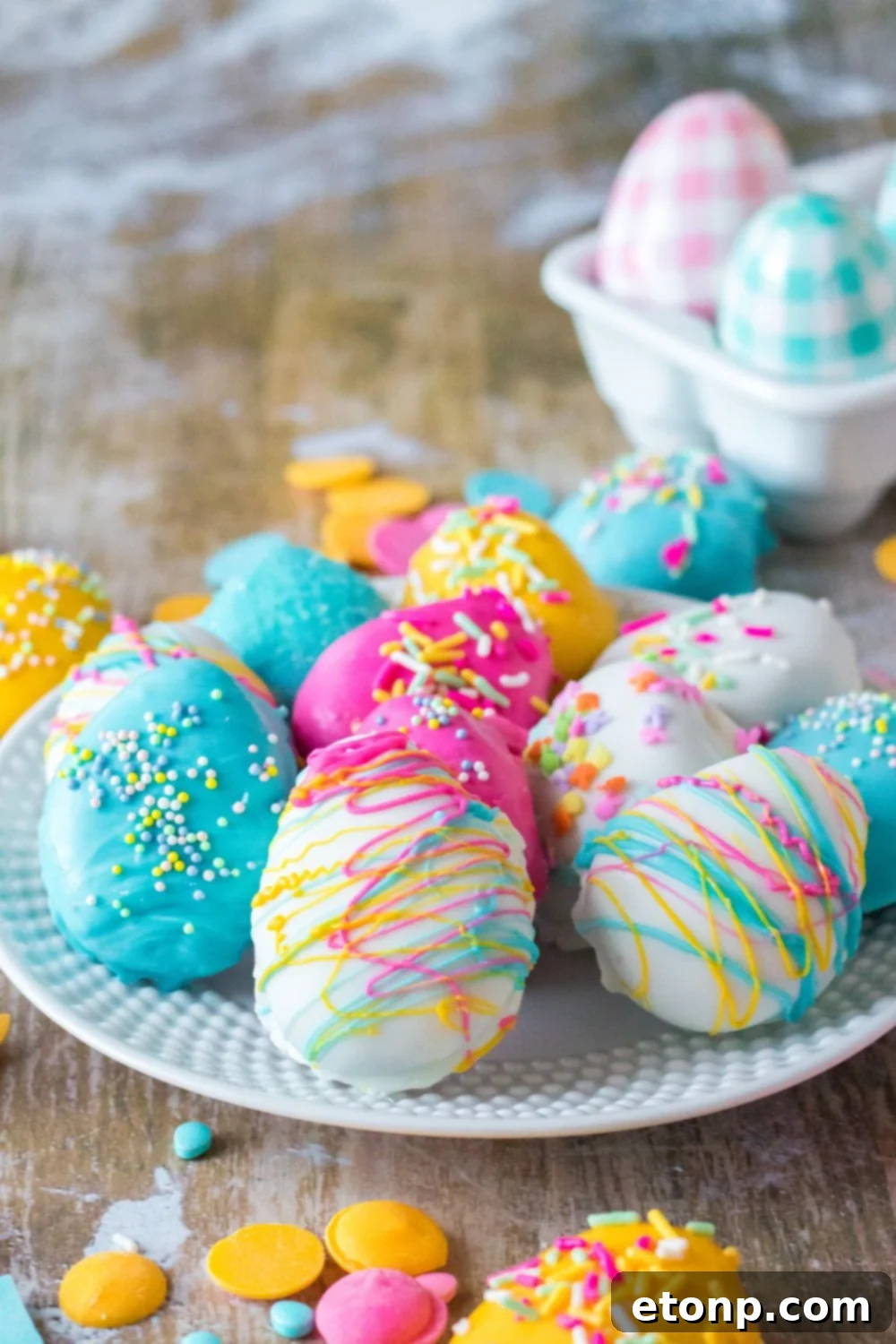 Easter Egg Oreo Truffles on a table with Easter decorations around the table 