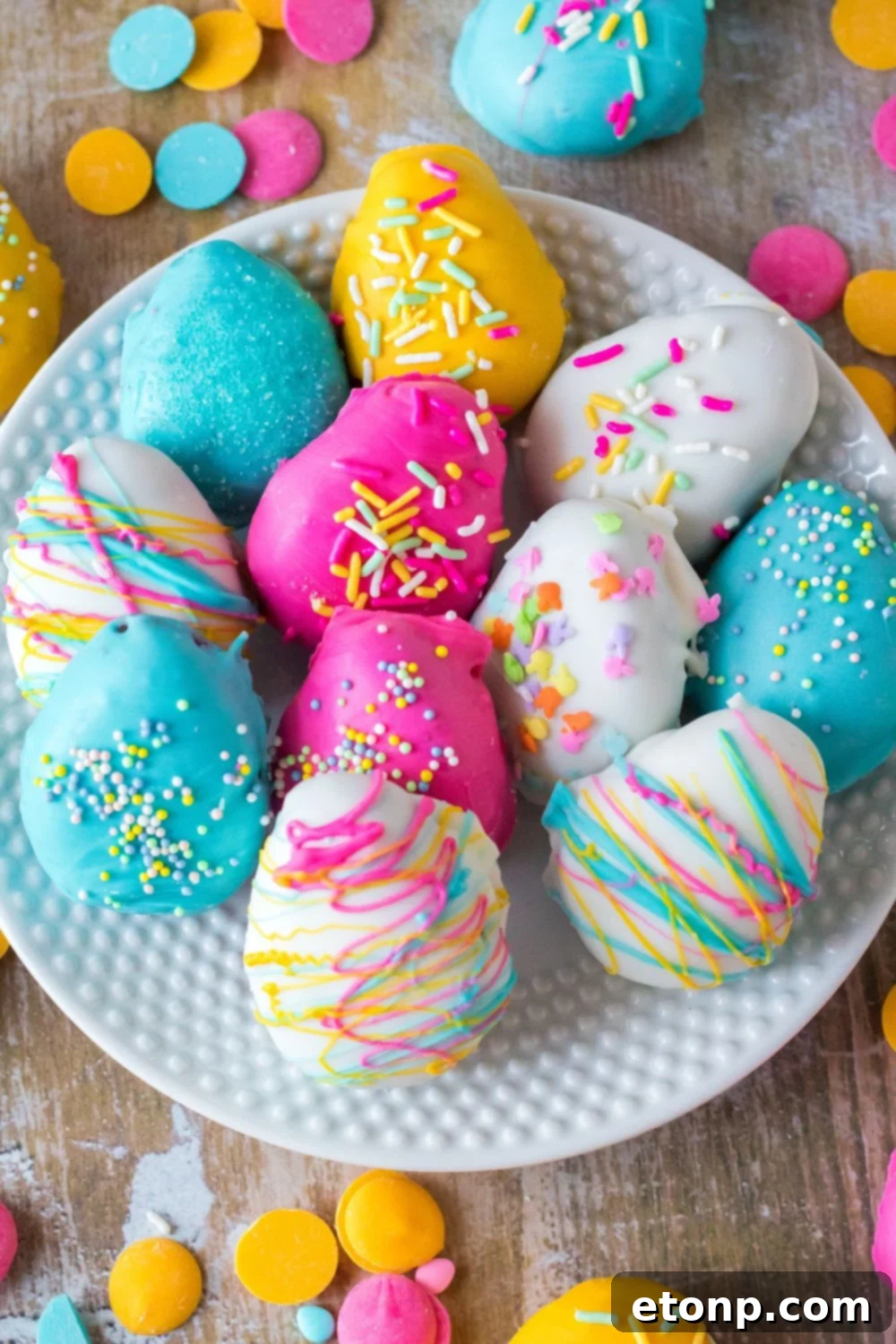 Easter Egg Oreo Truffles spread out over a plate on a table 