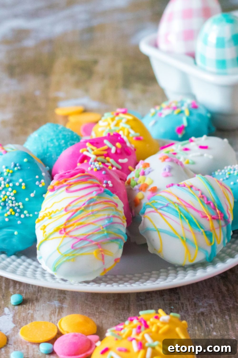 Easter Egg Oreo Truffles on a plate with a close up view of decorations 
