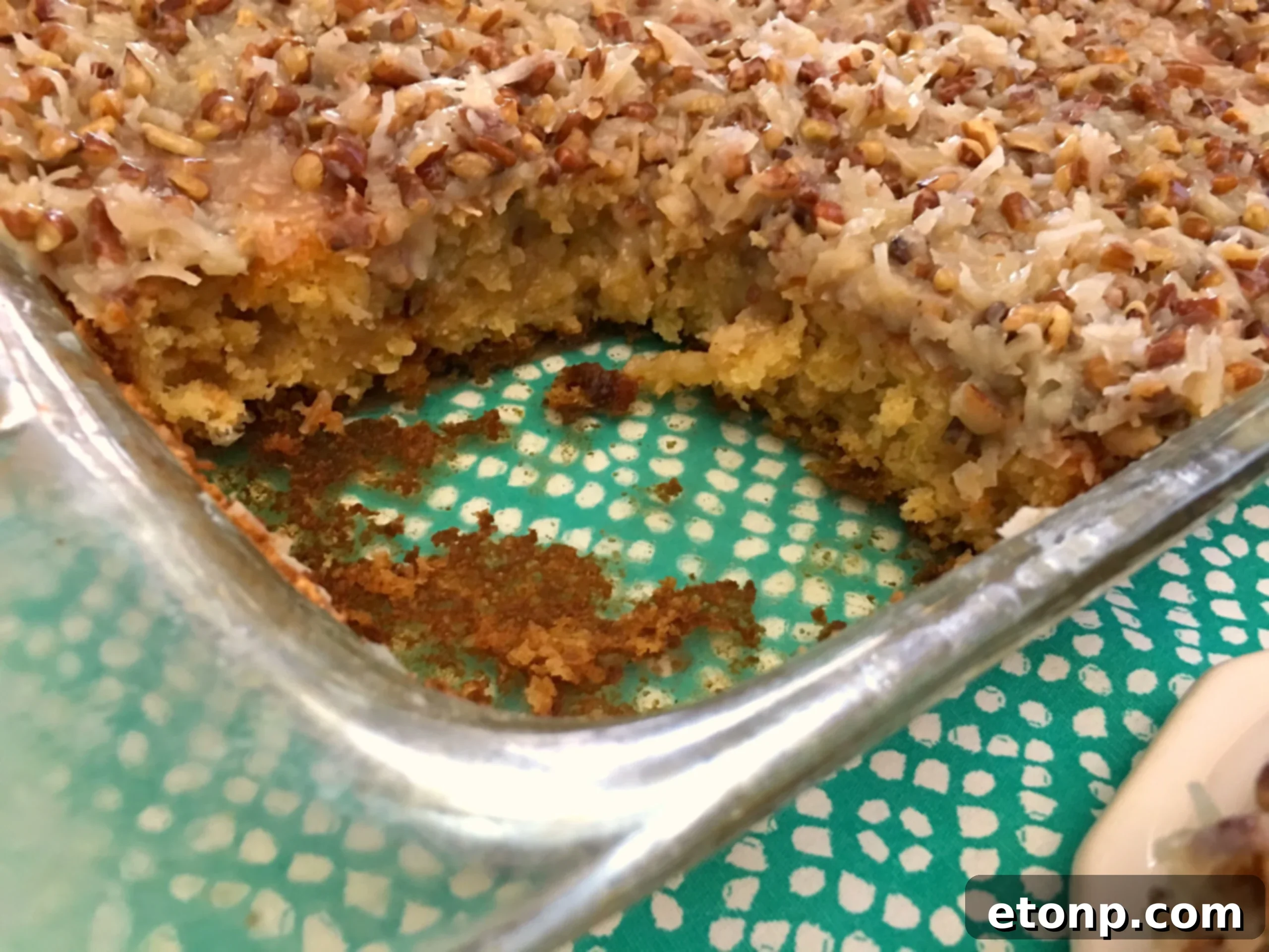 Super Simple Tornado Cake! 8 Close-up of the cake's moist interior and rich topping with pecans