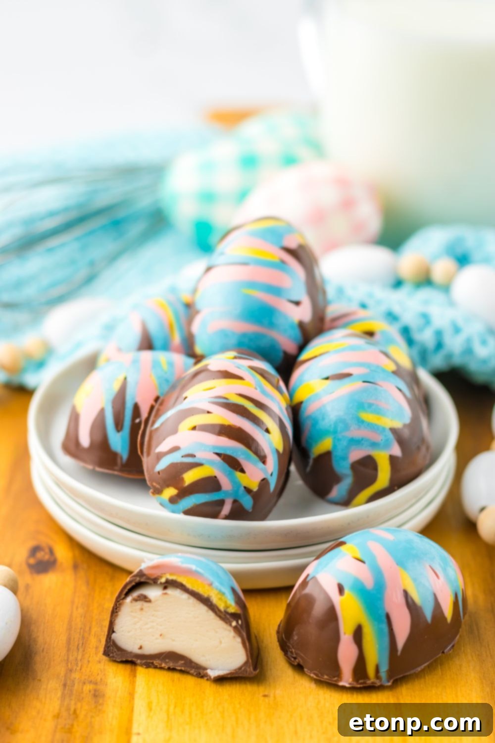 Easter Marshmallow Eggs that ar chocolate and pastel colored chocolates sitting on table in a bowl 