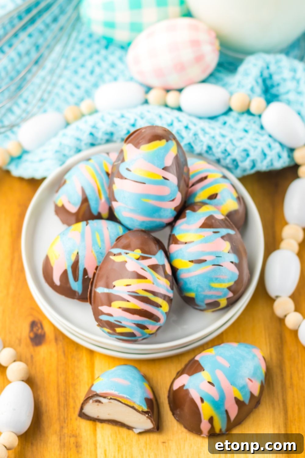 Easter Marshmallow Eggs on a plate with Easter decor around it 