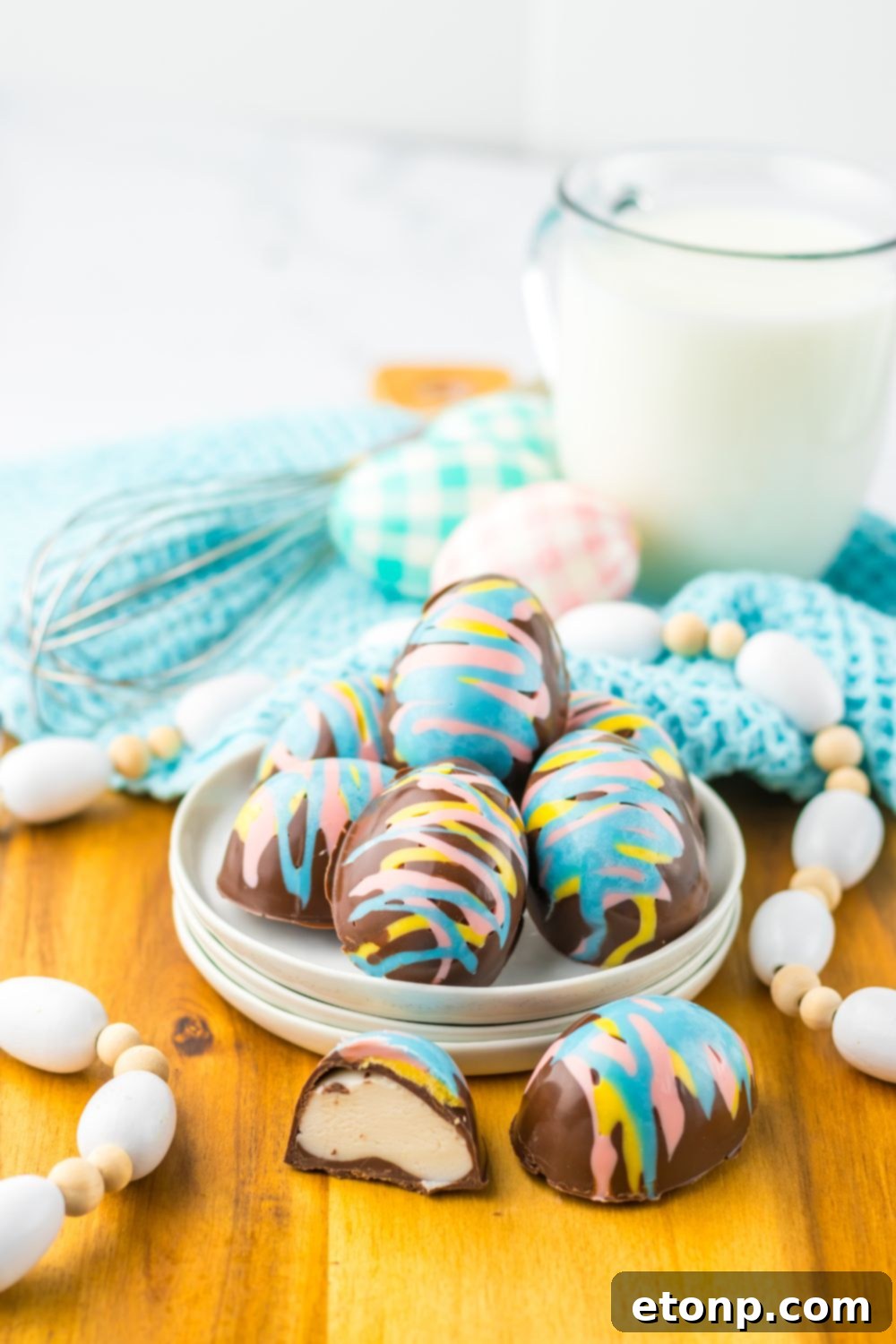 Easter Marshmallow Eggs in a tray with an egg sliced in half 