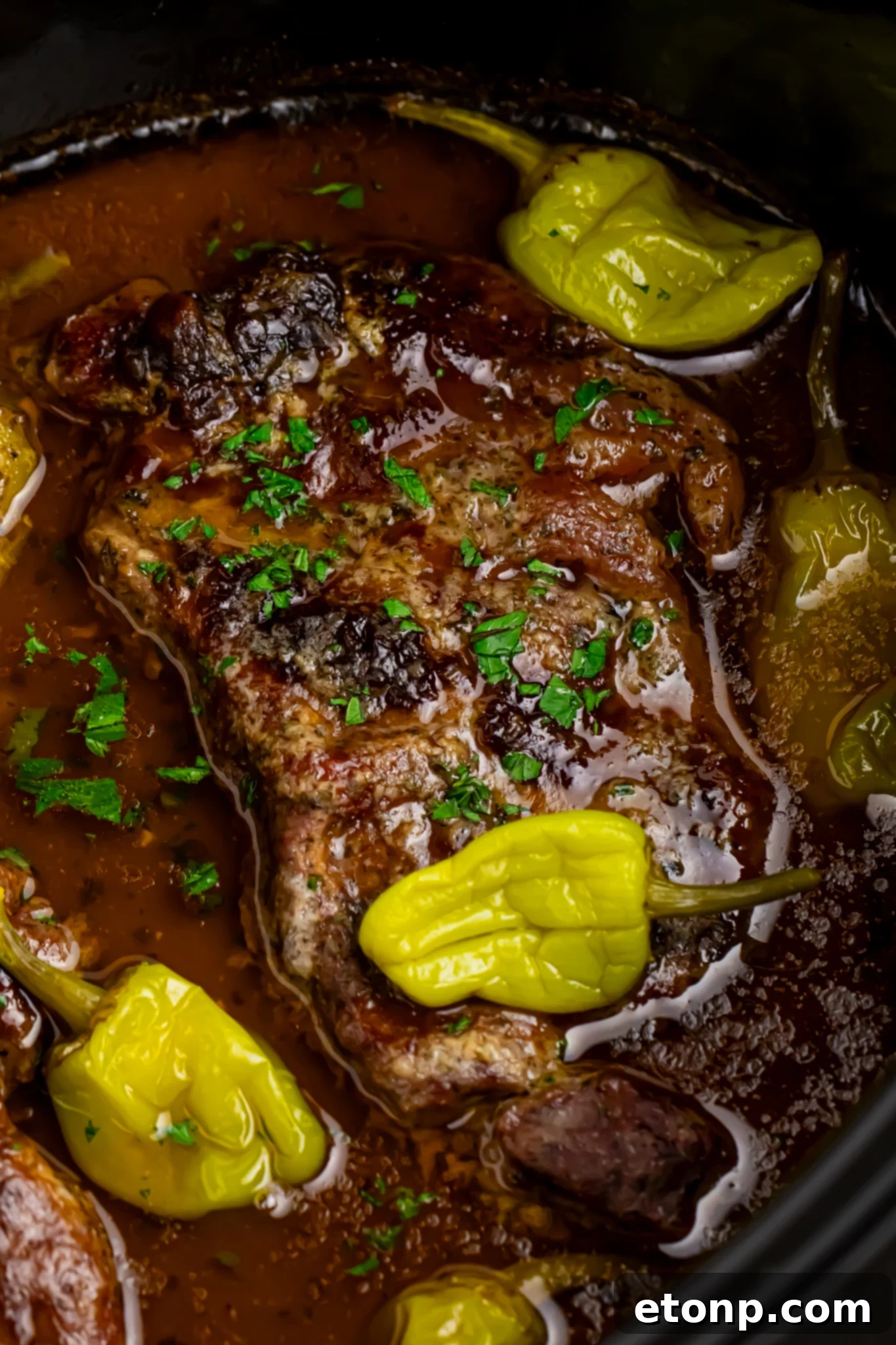 Slow cooker Mississippi ribeye steaks up close shot in a crockpot to show texture