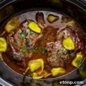 Slow Cooker Mississippi Ribeye Steaks in a slow cooker on table