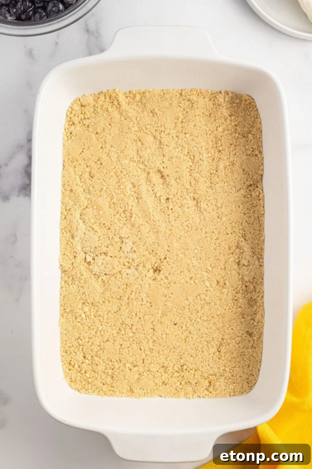 Lemon Blueberry Dream 7 graham cracker crust pressed into pan for making Lemon Blueberry Lush