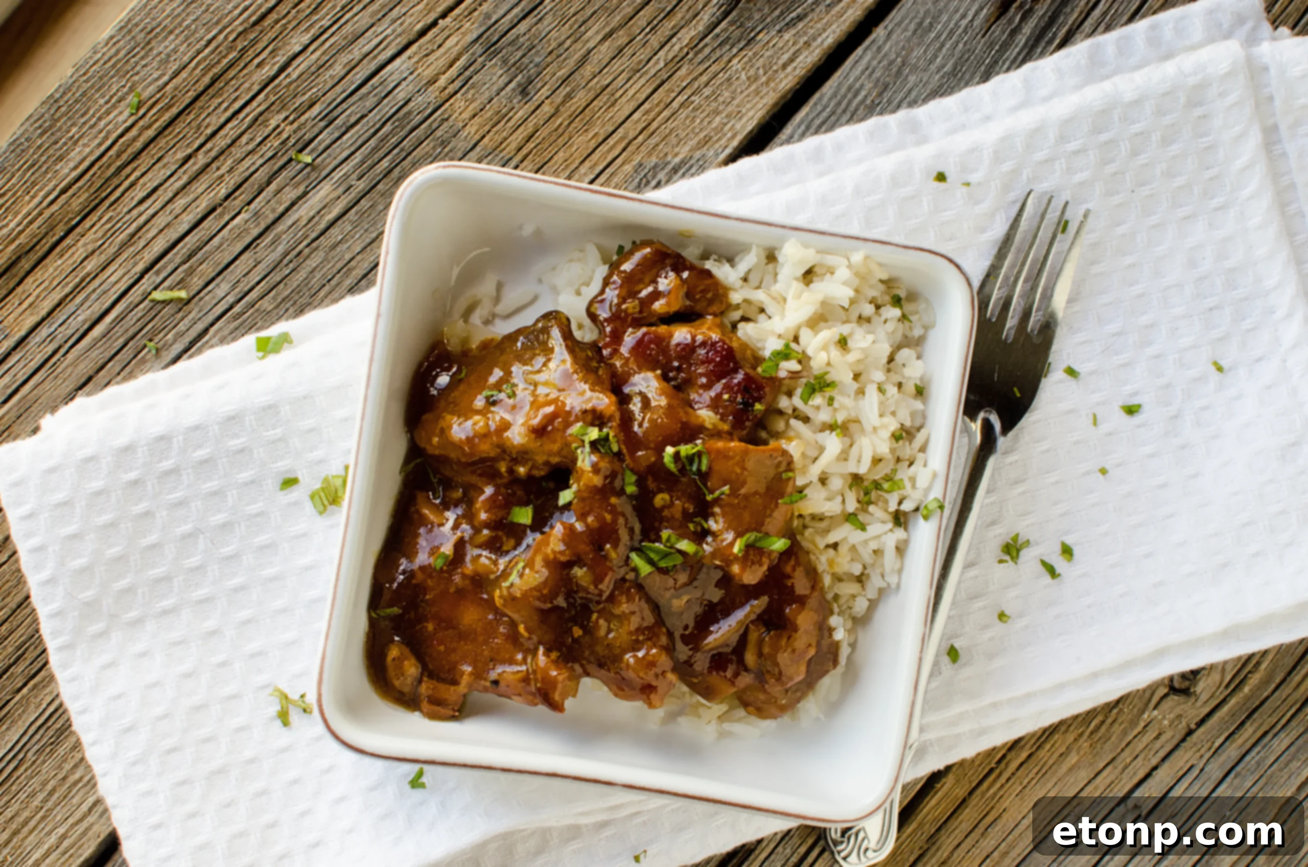 A large pot of Slow Cooker Garlic Ginger Pork, ready to be served