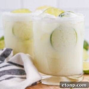 Brazilian Limeades in glasses on table with a towel around it