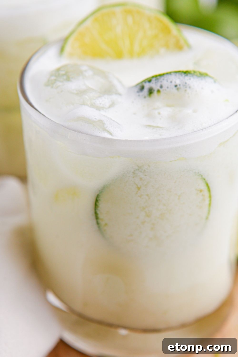 Brazilian Limeade in a glass with some lime slices in glass 