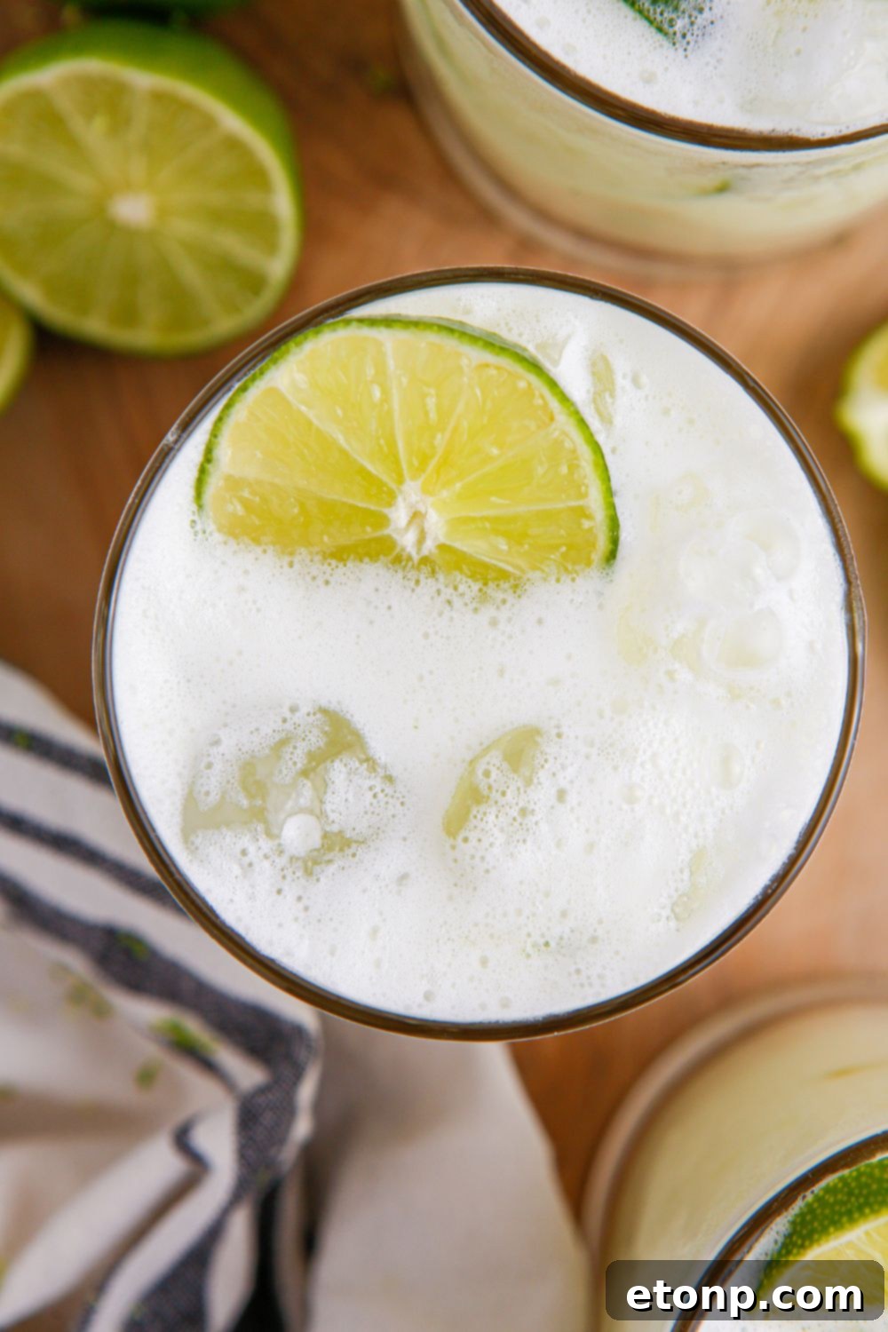 Brazilian Limeade overhead look of it in glass with a lime garnish 