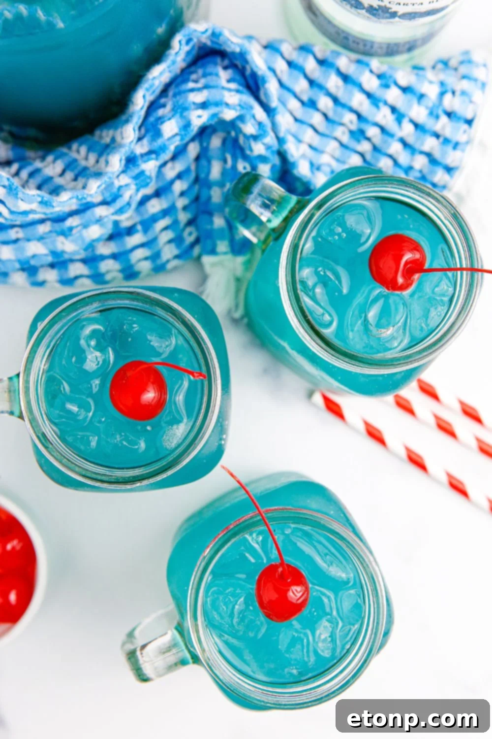 Blue Hawaiian Punch in glasses sitting on table