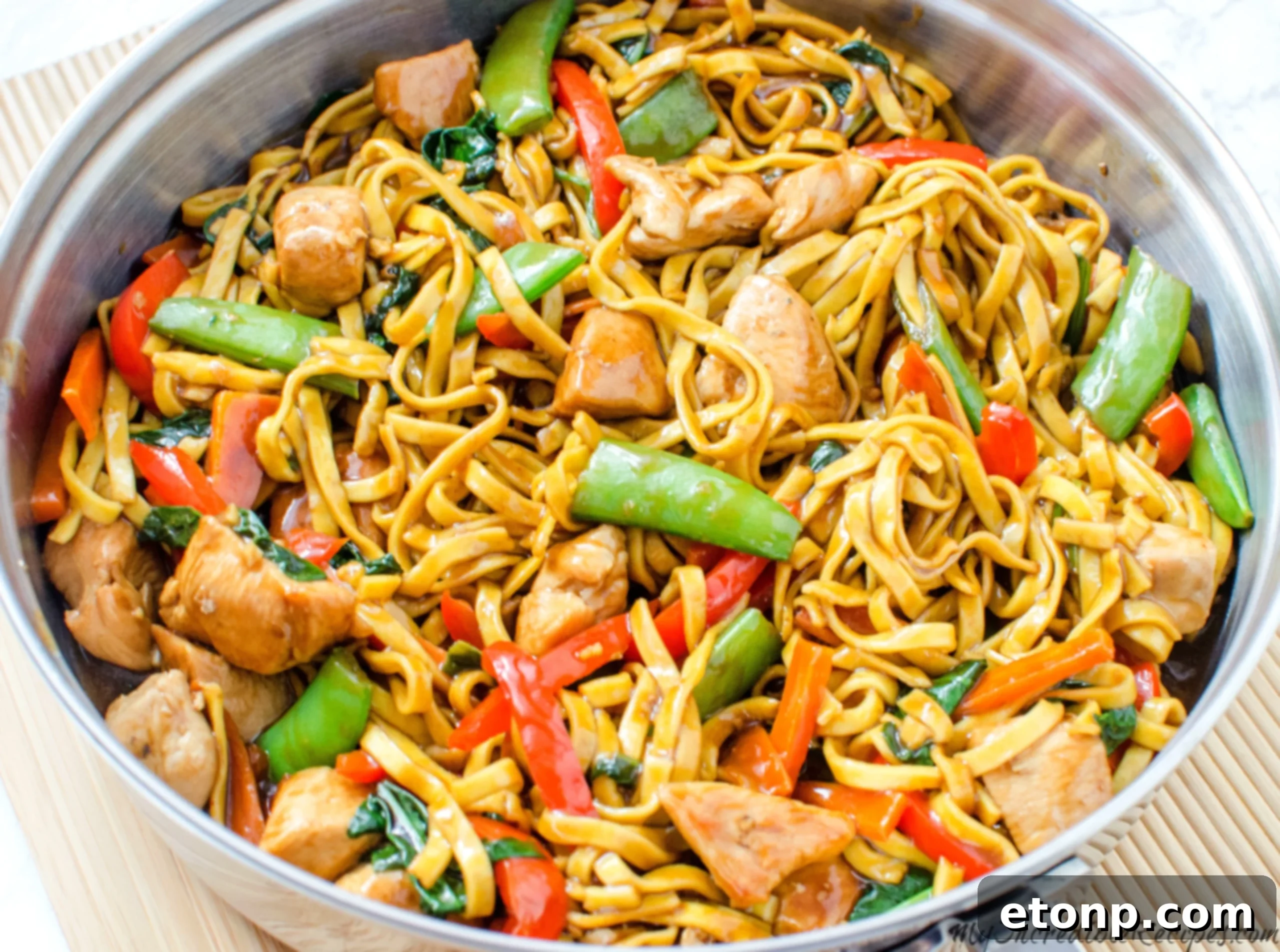 Delicious homemade chicken lo mein noodles in a pan