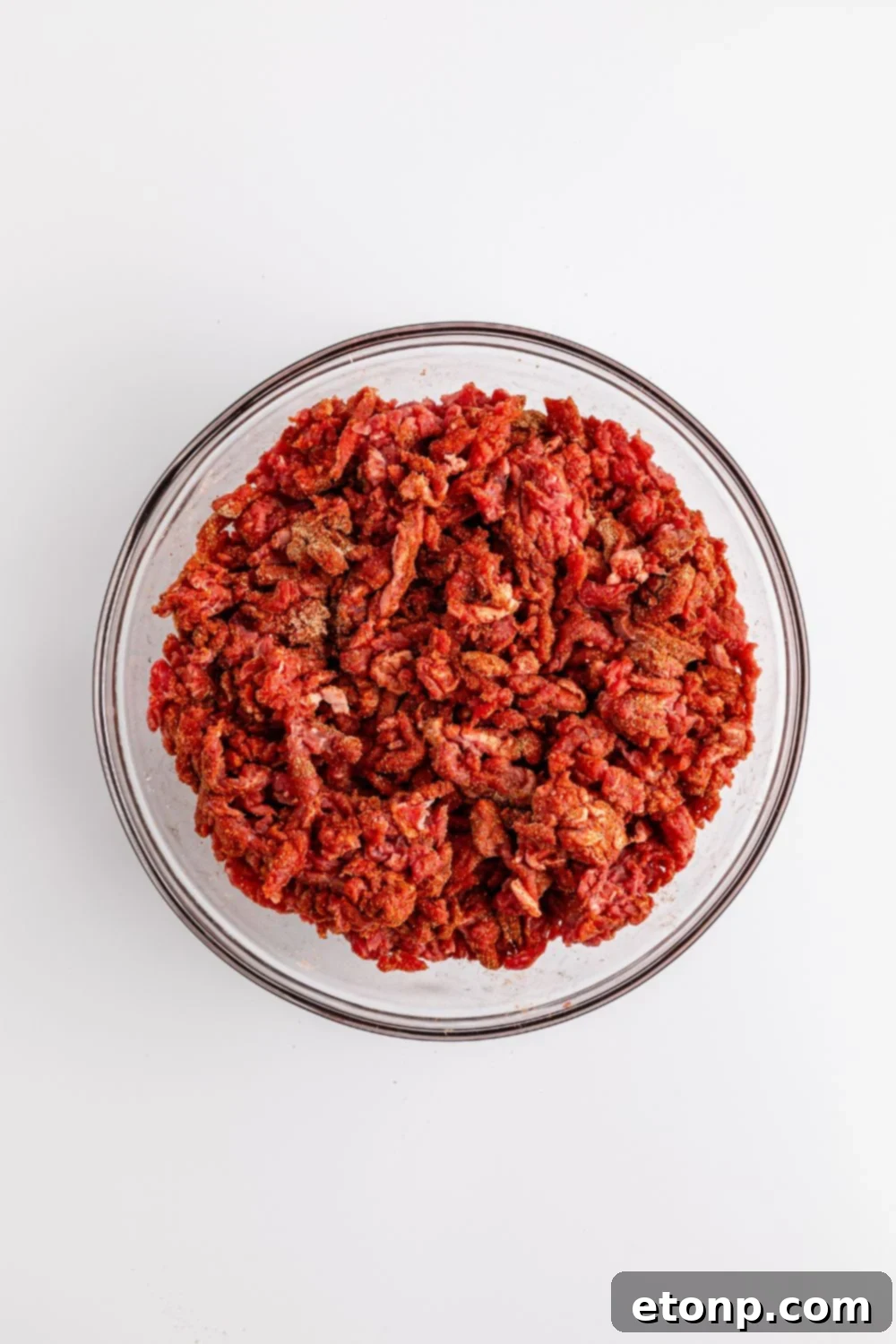 Ground Beef 8 seasoned chopped beef in a glass bowl