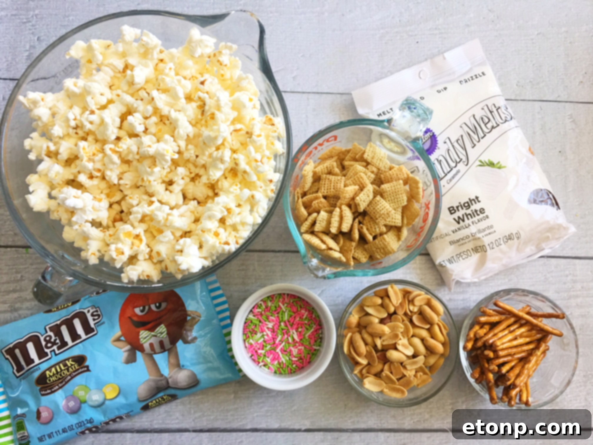 Close-up of freshly made Easter Bunny Bait snack mix with pastel M&Ms and sprinkles.