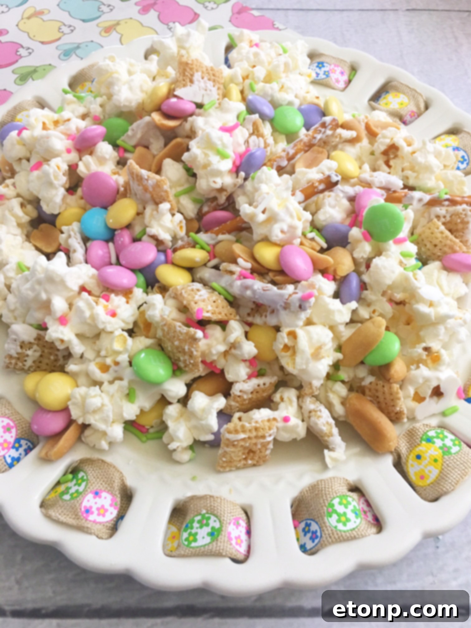 A serving bowl filled with Bunny Bait Easter snack mix, ready for enjoyment.