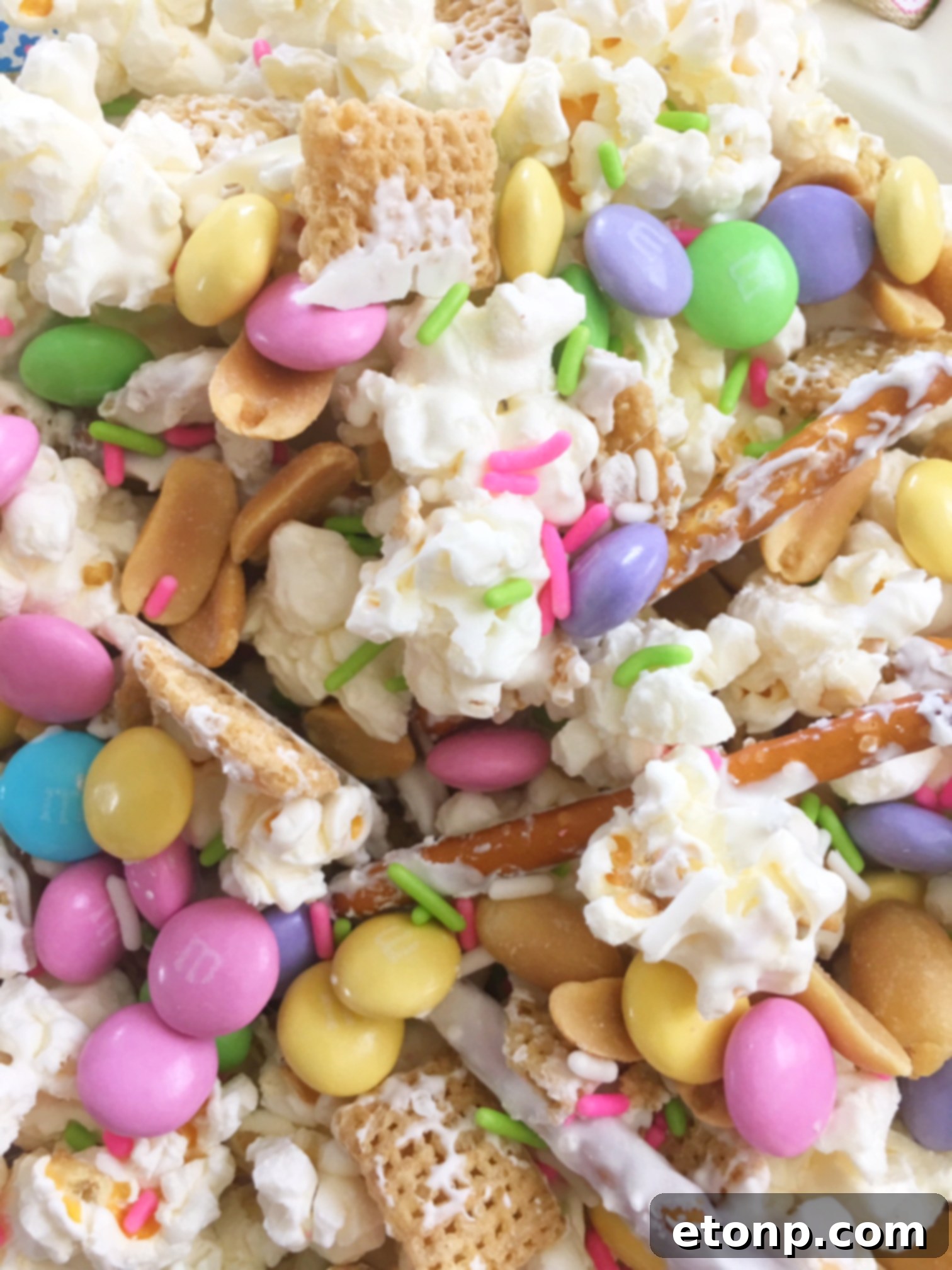 A portion of Bunny Bait Easter snack mix with a focus on the various crunchy elements.