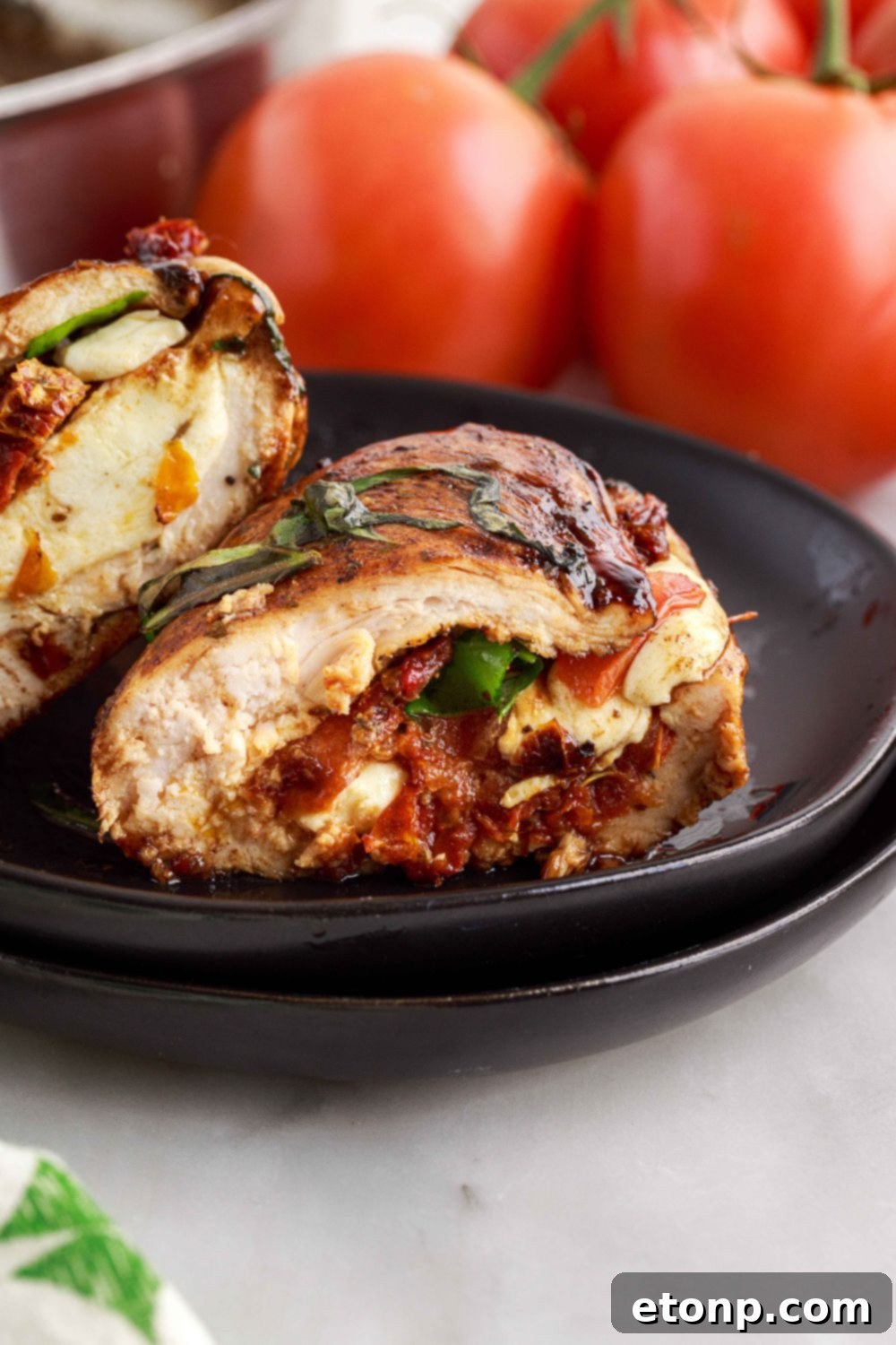 Close-up of a Caprese Stuffed Chicken breast, showing the delicious filling