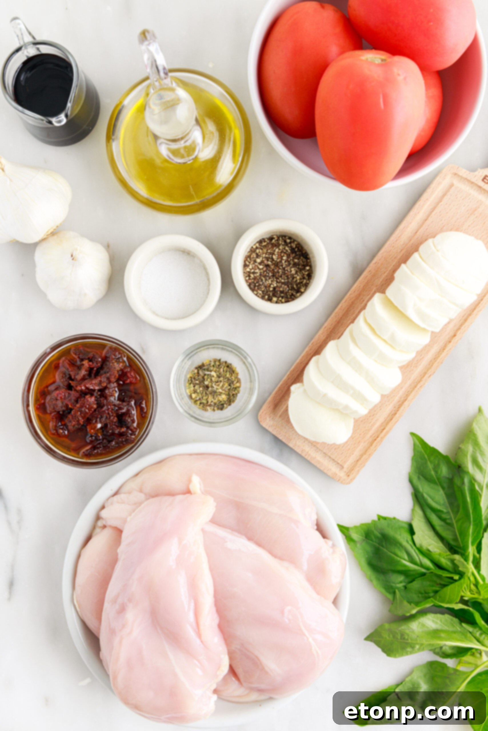 Caprese Stuffed Chicken ingredients neatly arranged in individual containers on a table