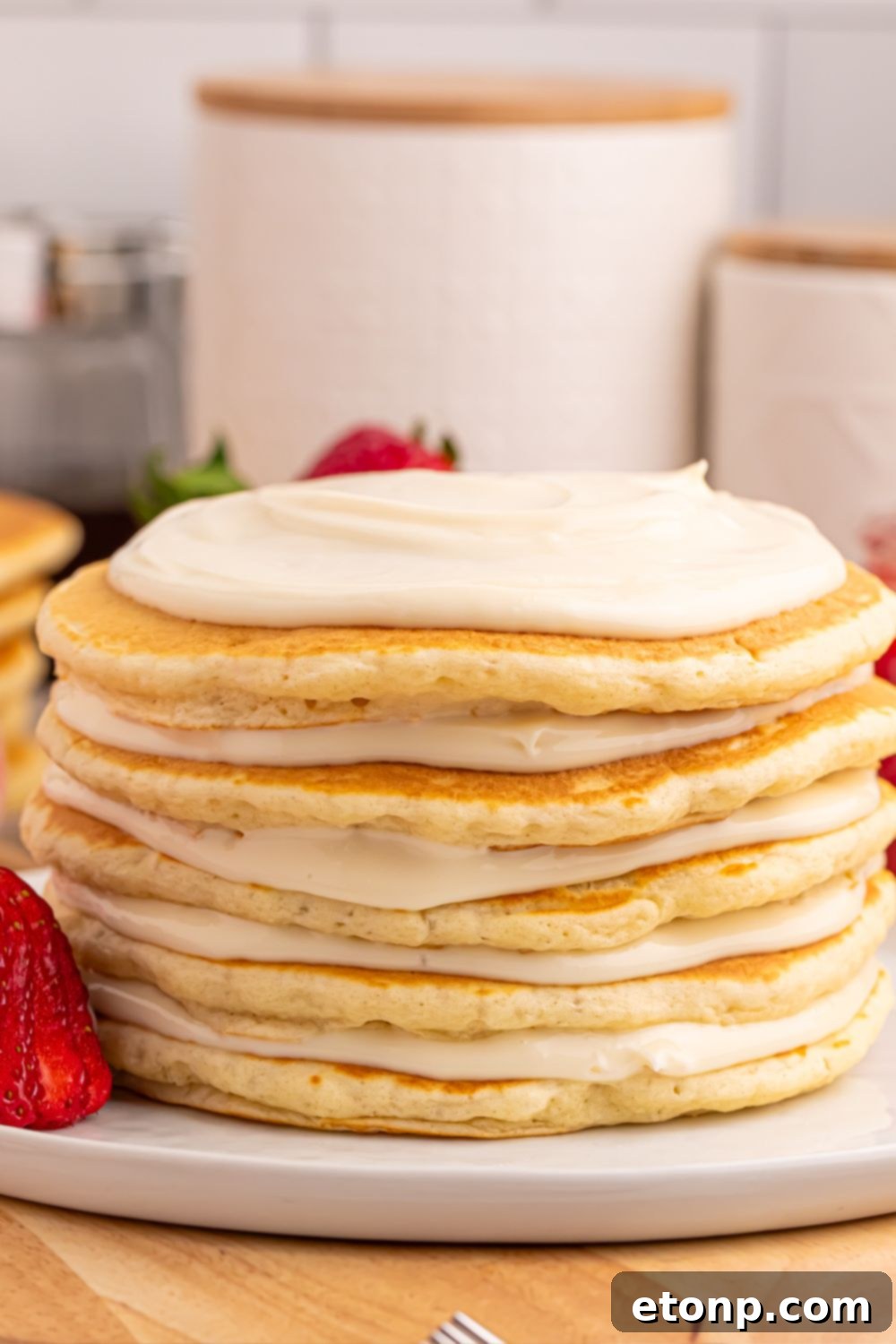 Pancakes with cream cheese cheesecake spread on top of each one