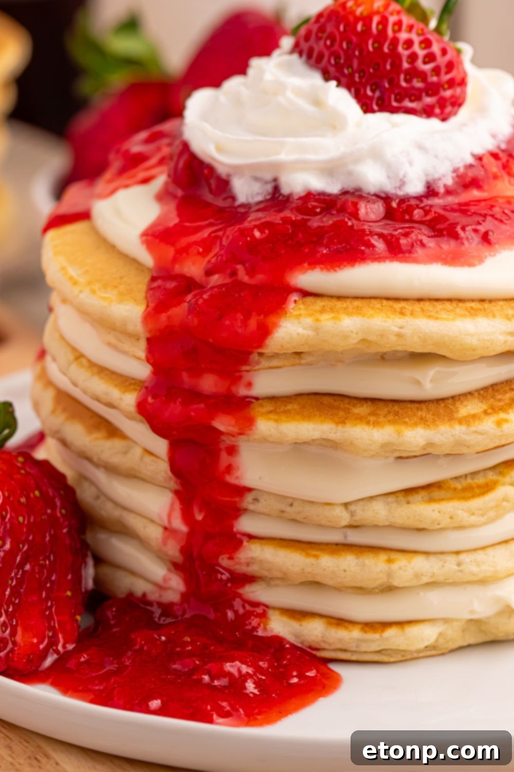 Close-up of Strawberry Cheesecake Pancakes showing distinct layers of cheesecake and fluffy pancakes