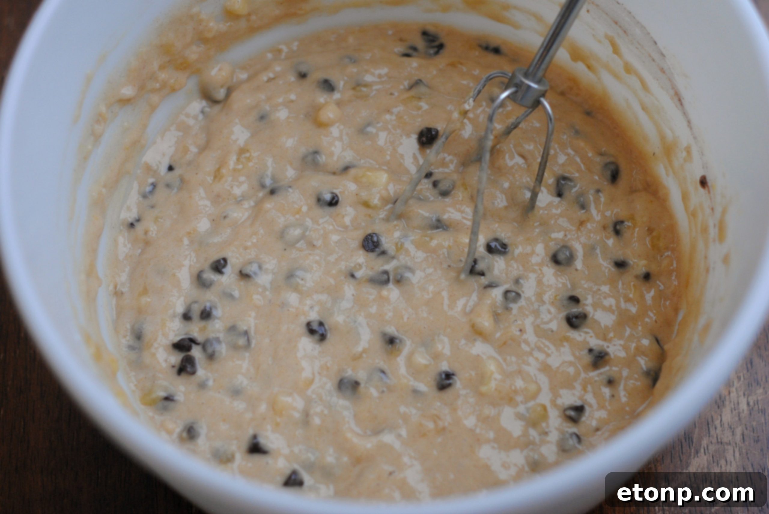 A batch of freshly baked chocolate chip muffins