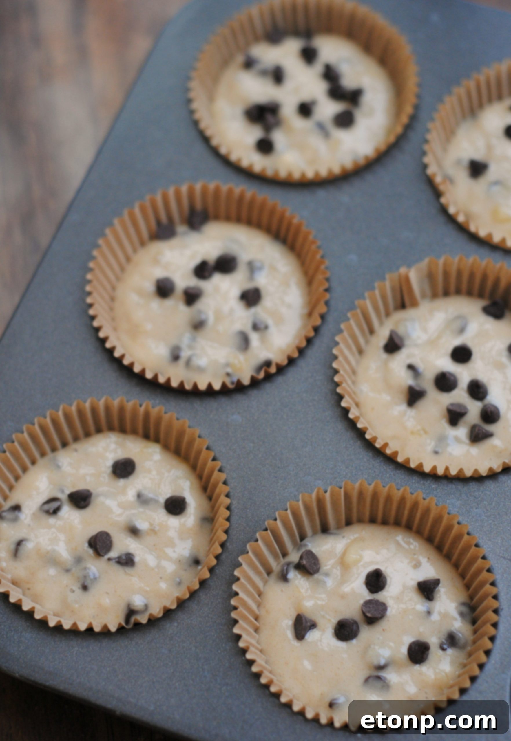 Ingredients for chocolate chip muffins, including bananas and honey