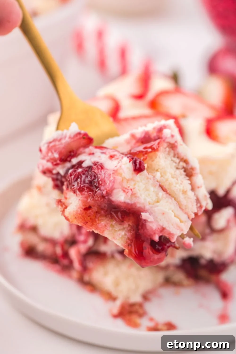 Strawberry Dream Tiramisu 18 A fork holding a perfect bite of Strawberry Tiramisu, showing the distinct layers.