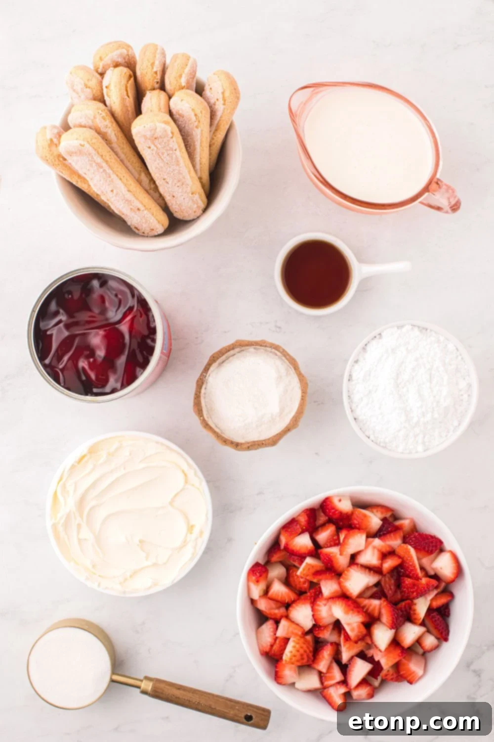 Strawberry Dream Tiramisu 6 Individual containers displaying the key ingredients for Strawberry Tiramisu, neatly arranged on a table.