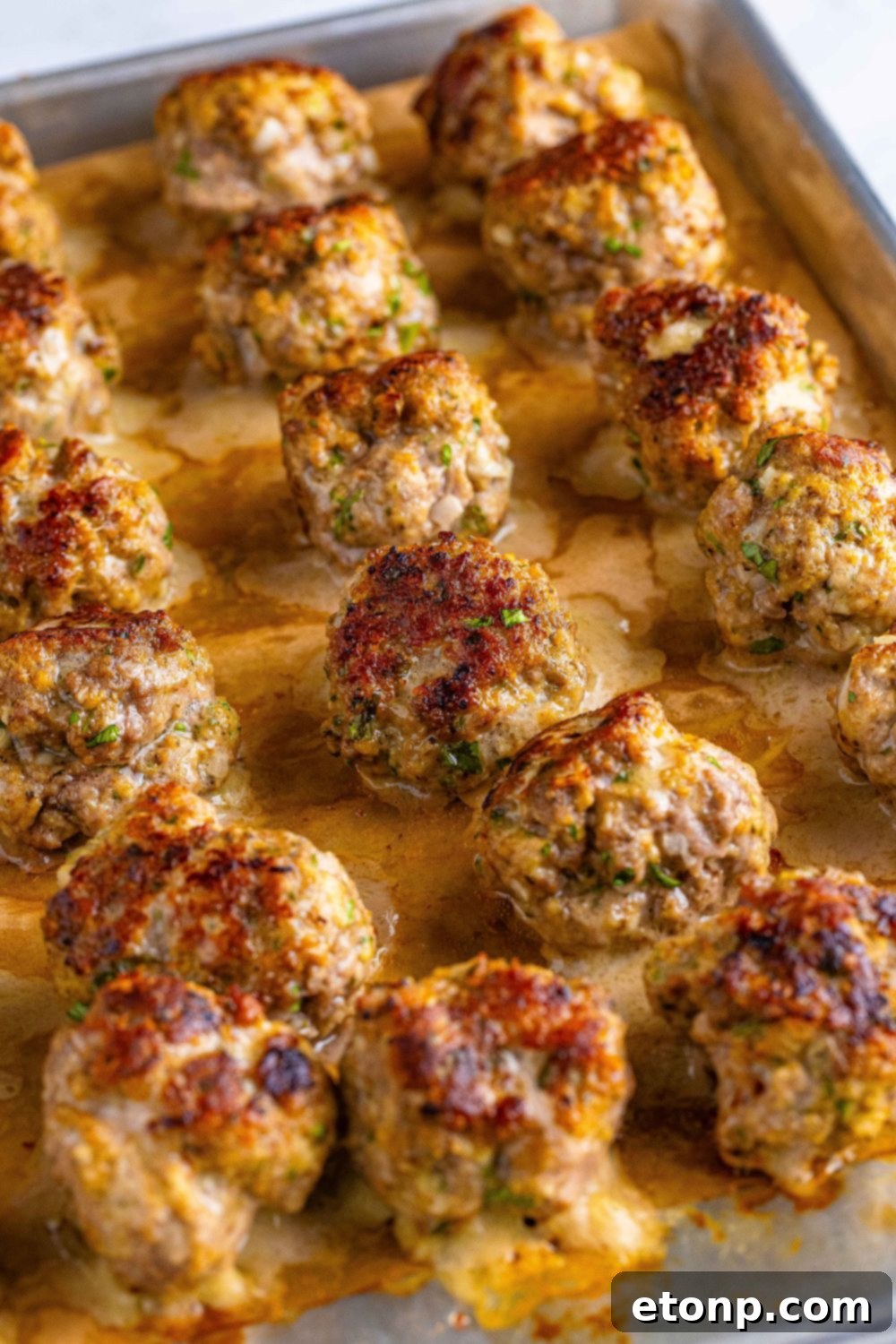 cooked Classic Italian Meatballs on a baking tray after being baked in oven 