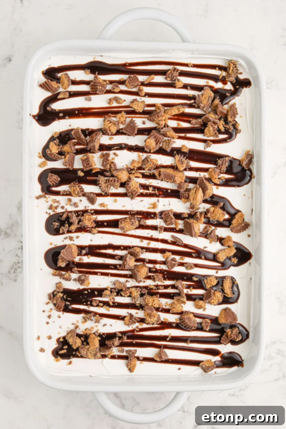 Reese's Peanut Butter Bliss Stack 12 The fully assembled Reese's Lasagna, showcasing all its delicious layers, sitting ready in a pan on the table.