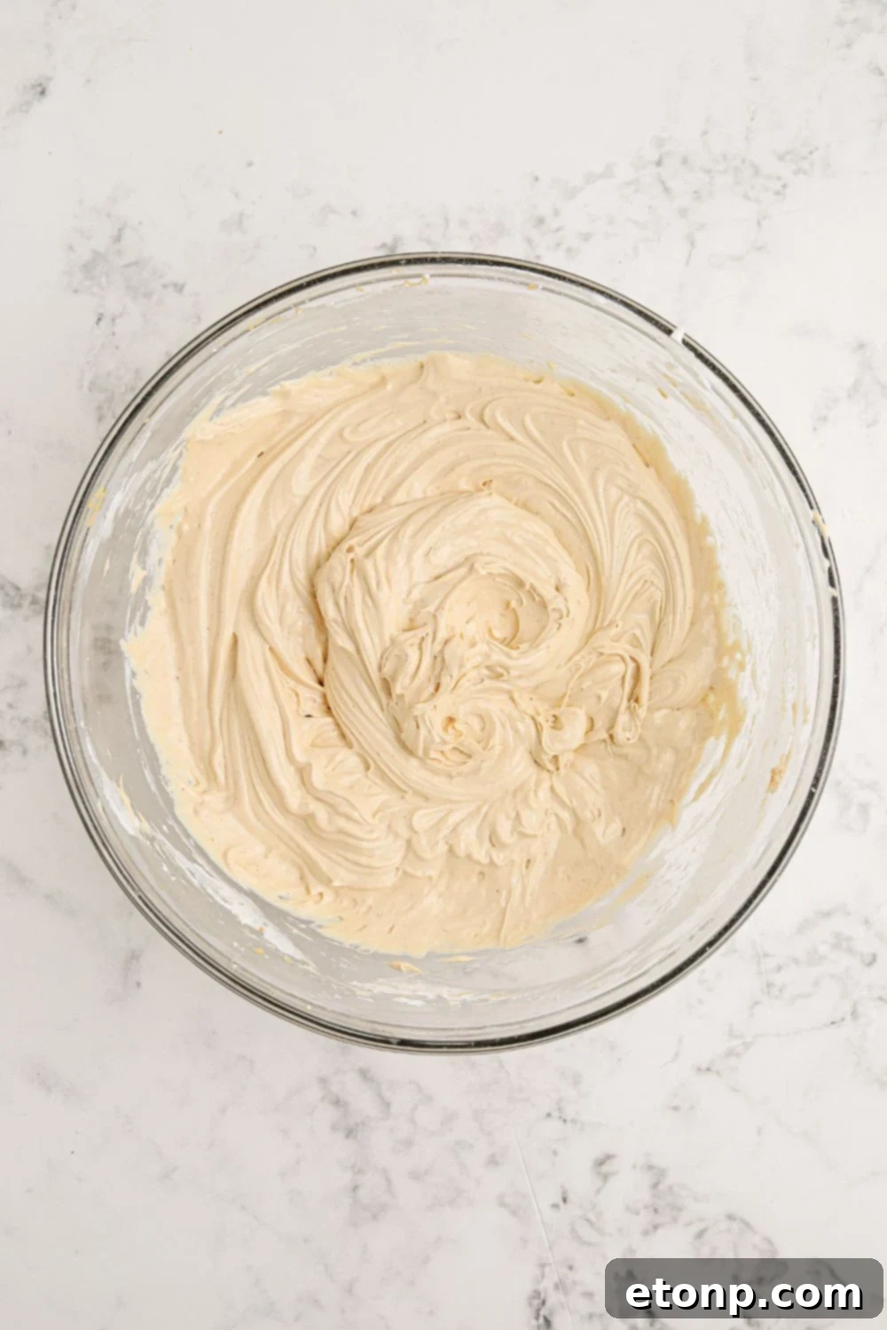 Reese's Peanut Butter Bliss Stack 8 Cream cheese and peanut butter perfectly blended in a glass bowl, ready for the Reese's Lasagna.