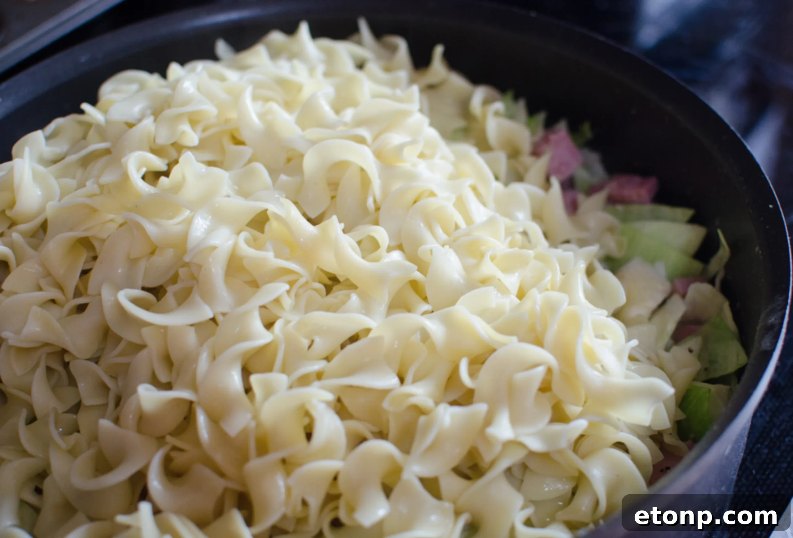 Fresh cabbage and onions chopped and ready for frying.
