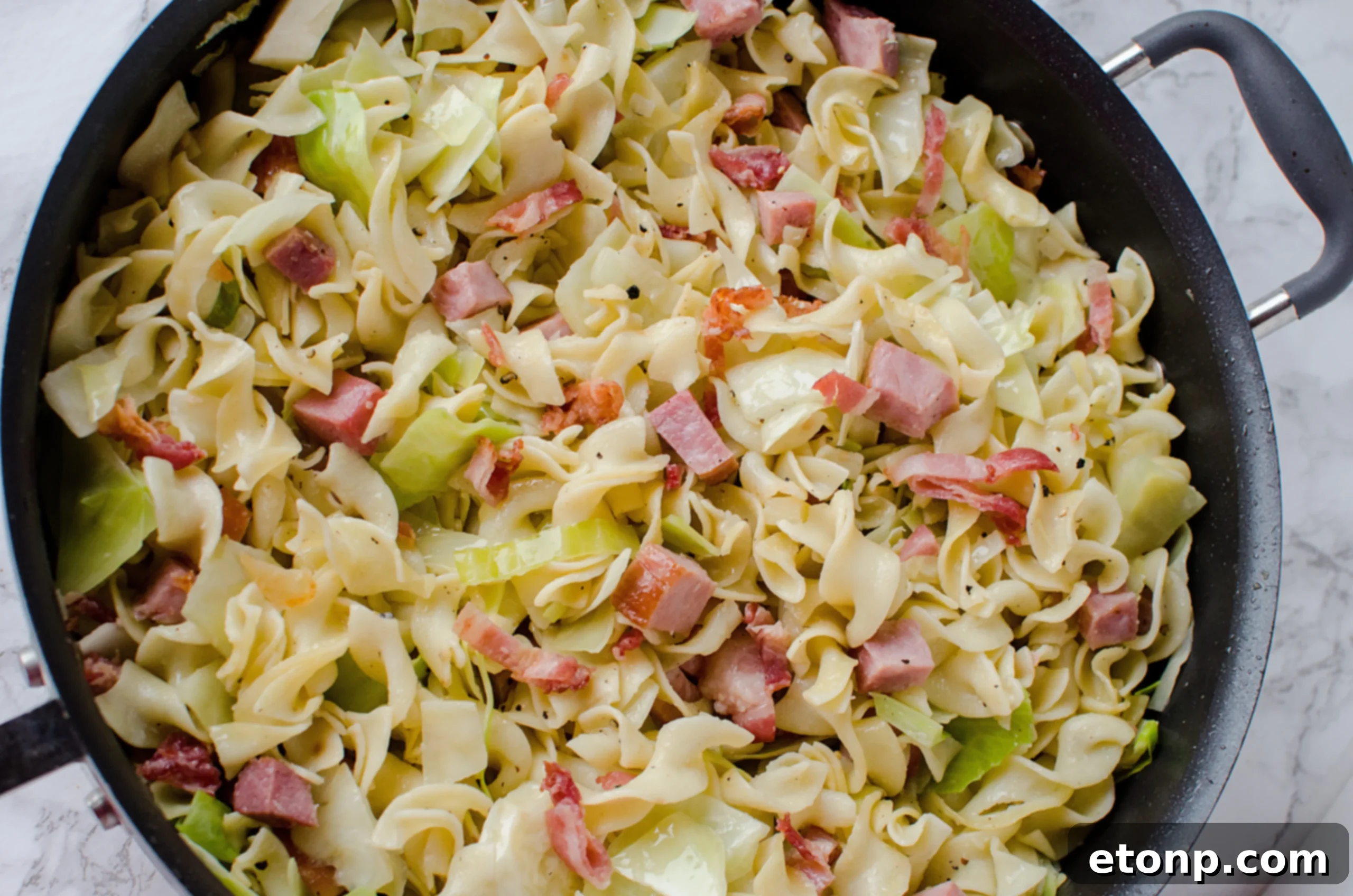 A large pot of boiling water, ready for cooking the noodles.