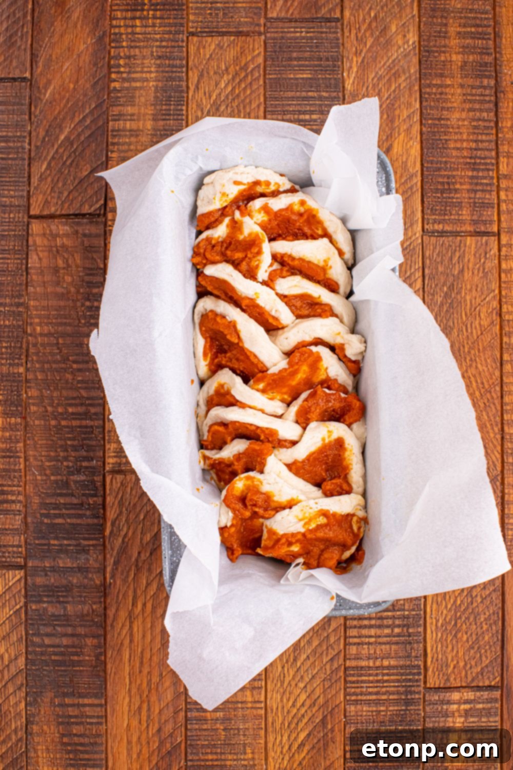 Golden Pumpkin Blossom Bread 8 Pumpkin Pie Pull Apart Bread in raw form in a pan on table