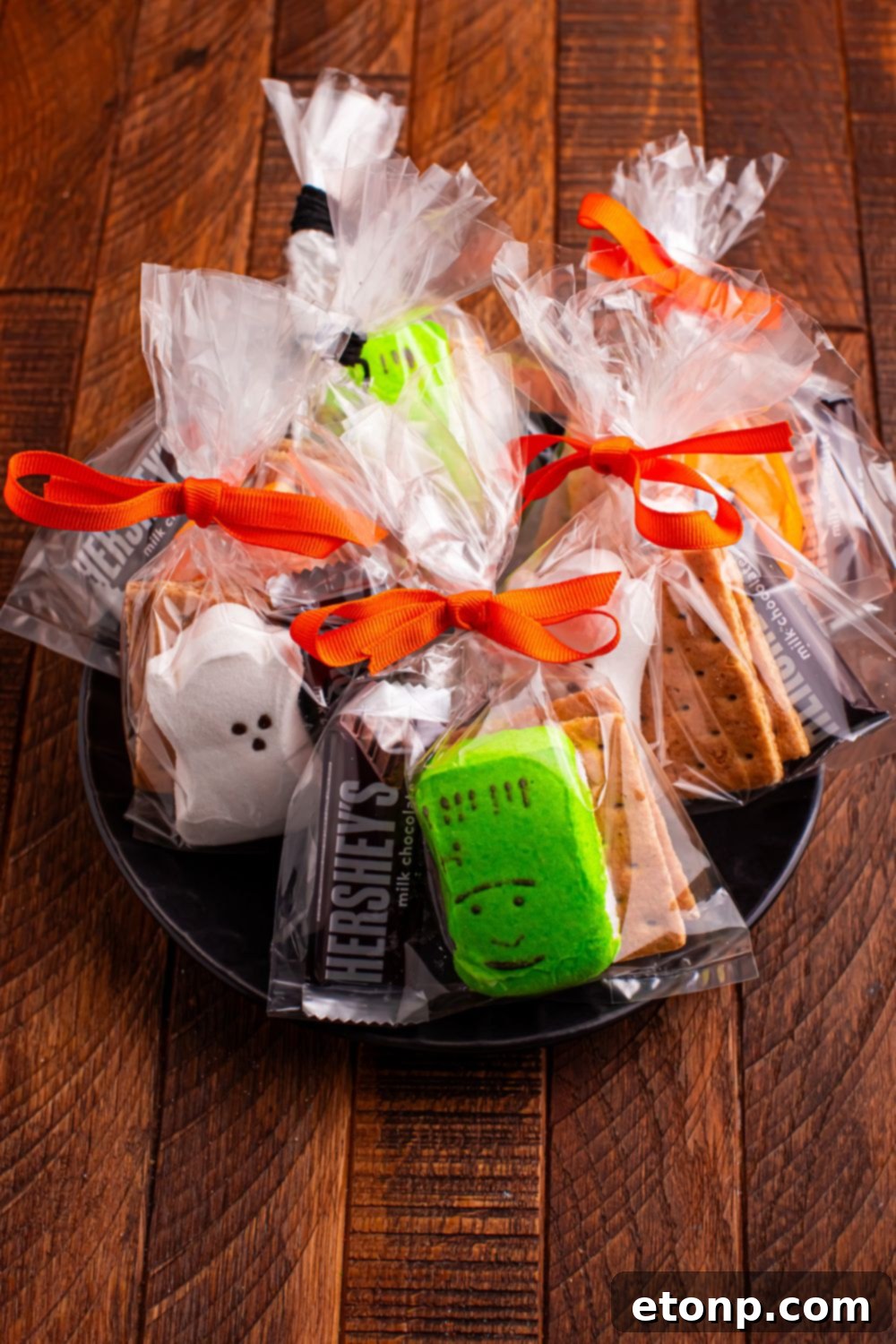 Spooky Smores Treat Packs 11 Halloween Smores Gift Bags on a black plate on table