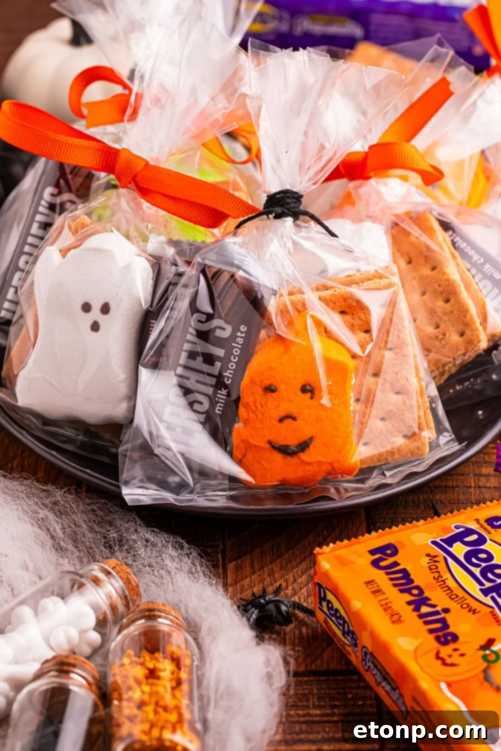 Spooky Smores Treat Packs 3 Halloween Smores Gift Bags in a black bowl sitting on table with package of peeps on table