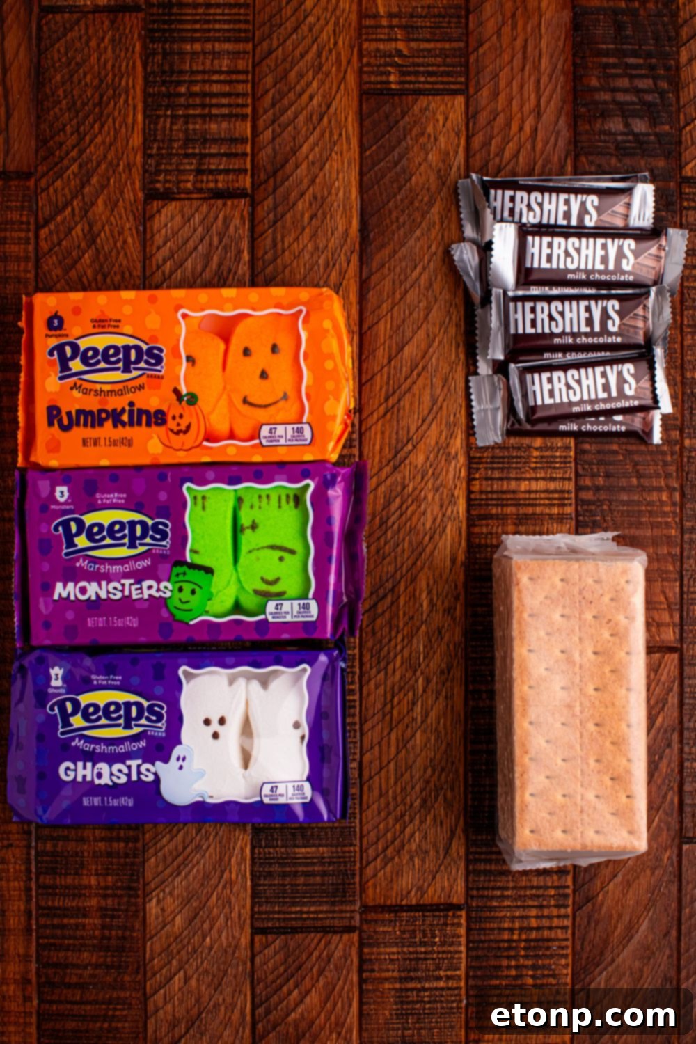 Spooky Smores Treat Packs 4 Halloween Smores Gift Bag ingredients on table: graham crackers, Hershey's, and Peep marshmallows